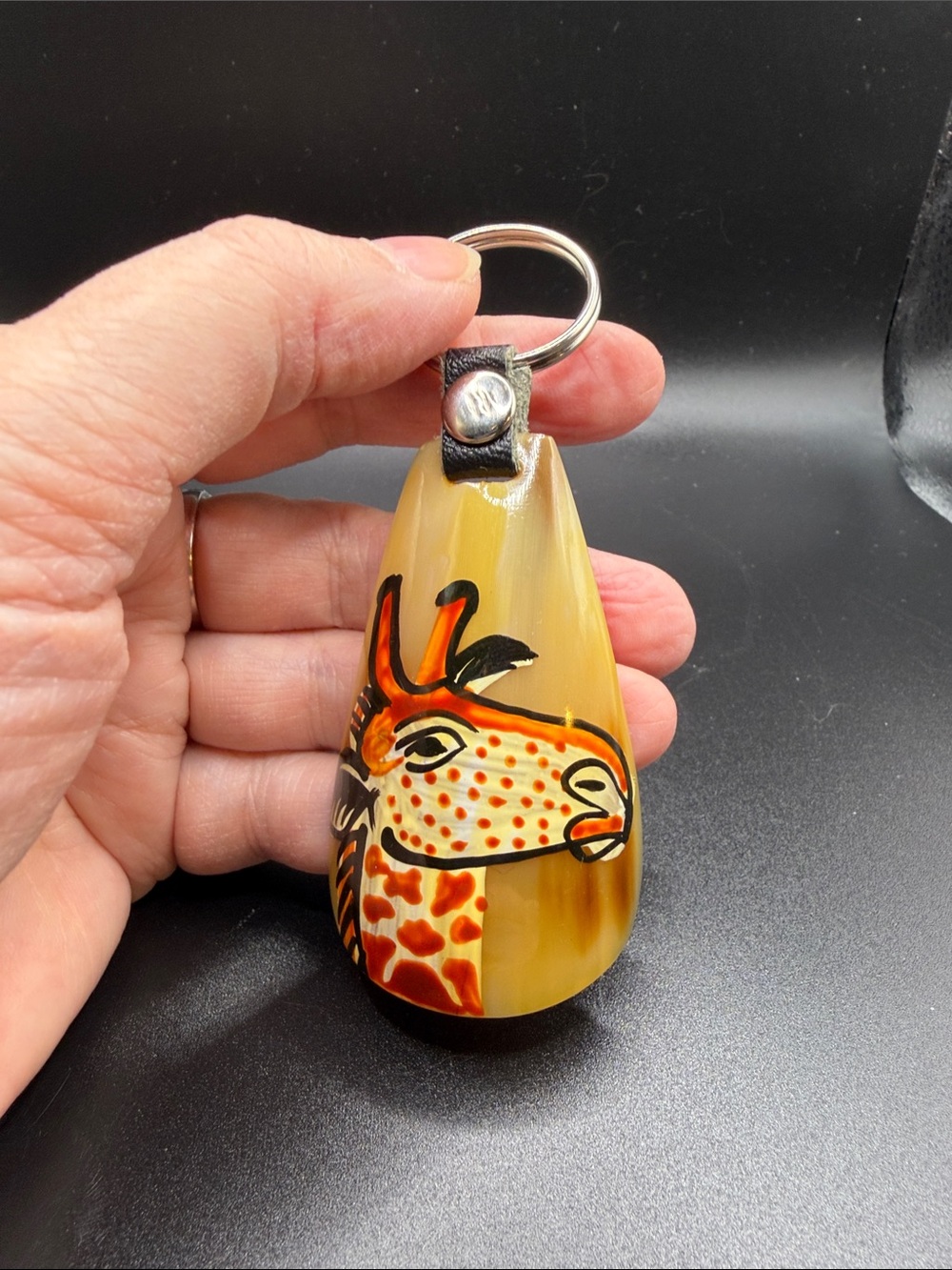 Handcrafted keychain from Africa. Giraffe motif. Great condition.